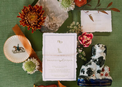 green and rust wedding invitations flatlay